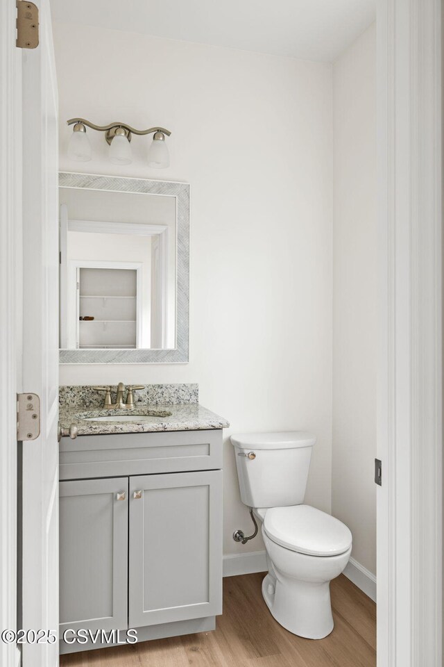 151 Hillside Ave, Elysburg, PA 17824 - bathroom with vanity, wood finished floors, toilet, and baseboards
