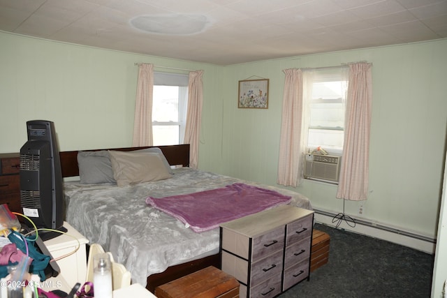 bedroom featuring cooling unit, a baseboard radiator, and dark carpet