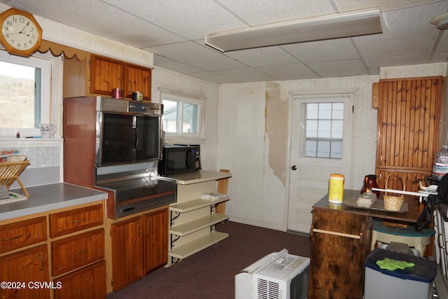 kitchen featuring a paneled ceiling