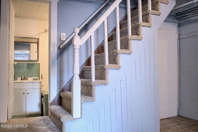 stairway featuring hardwood / wood-style flooring