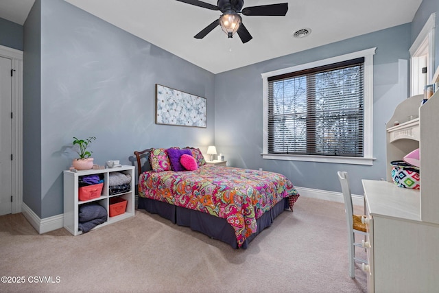 carpeted bedroom featuring ceiling fan, baseboards, and visible vents