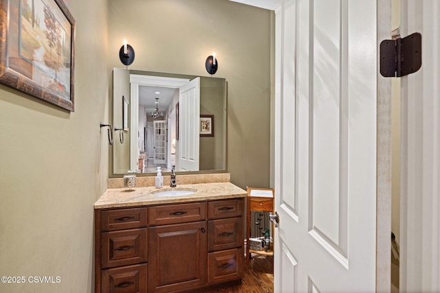 bathroom featuring vanity and wood finished floors