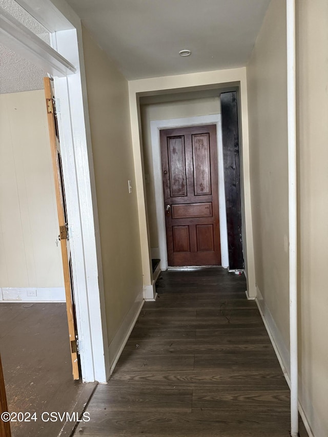 corridor featuring dark hardwood / wood-style flooring