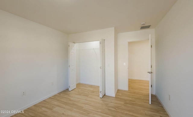 unfurnished bedroom with light hardwood / wood-style floors