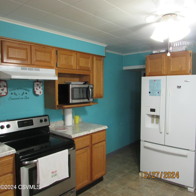 kitchen featuring stainless steel appliances and crown molding