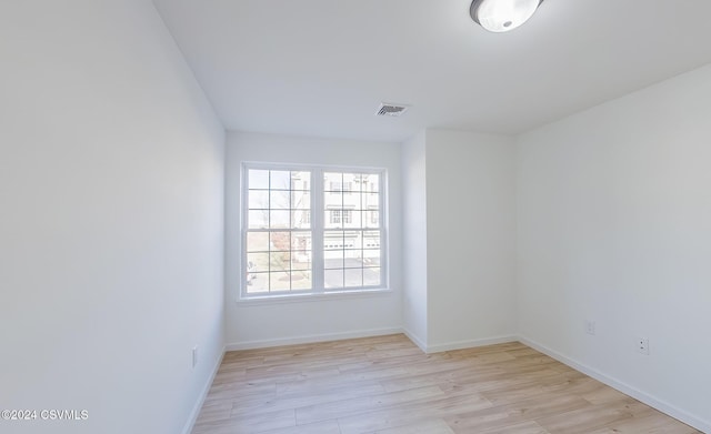 spare room featuring light wood-type flooring