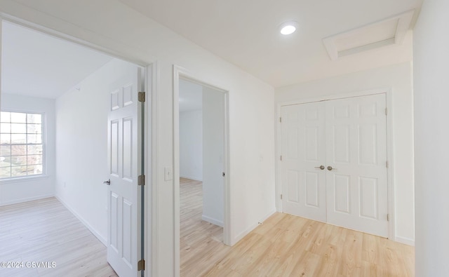 corridor with light wood-type flooring