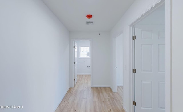 hall with light wood-type flooring