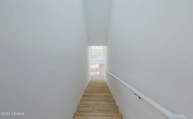 stairway featuring hardwood / wood-style flooring