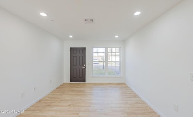 spare room featuring light hardwood / wood-style floors