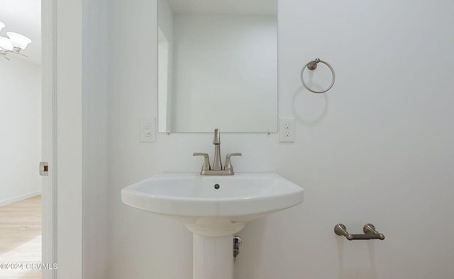 bathroom with hardwood / wood-style flooring