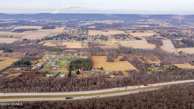 drone / aerial view featuring a mountain view and a rural view