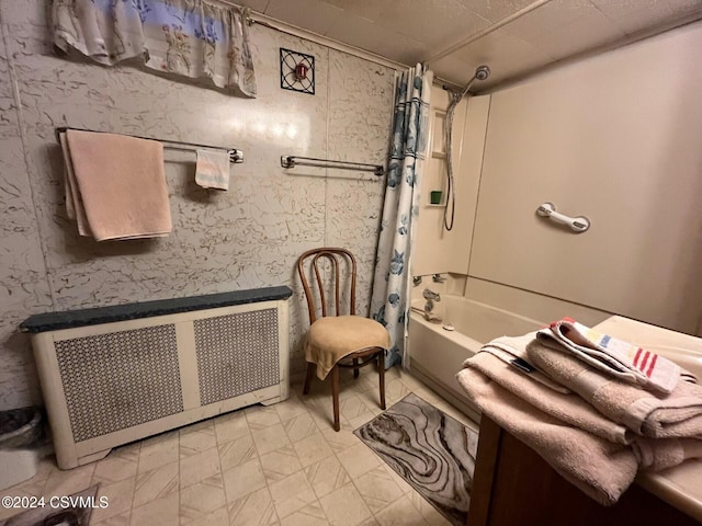 bathroom with shower / bath combination with curtain and radiator heating unit