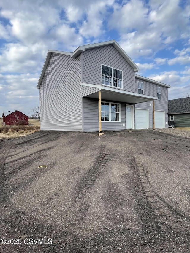 view of front of house with an attached garage and driveway