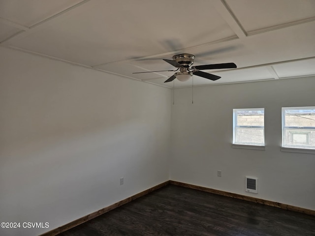 spare room featuring ceiling fan and dark hardwood / wood-style floors