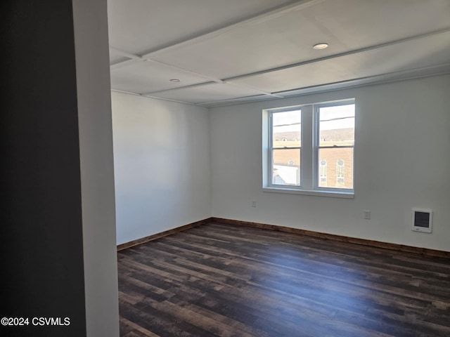 unfurnished room featuring dark wood-type flooring