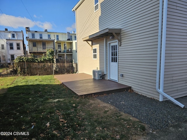 view of yard featuring central AC unit and a wooden deck