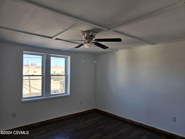 empty room with dark hardwood / wood-style flooring and ceiling fan