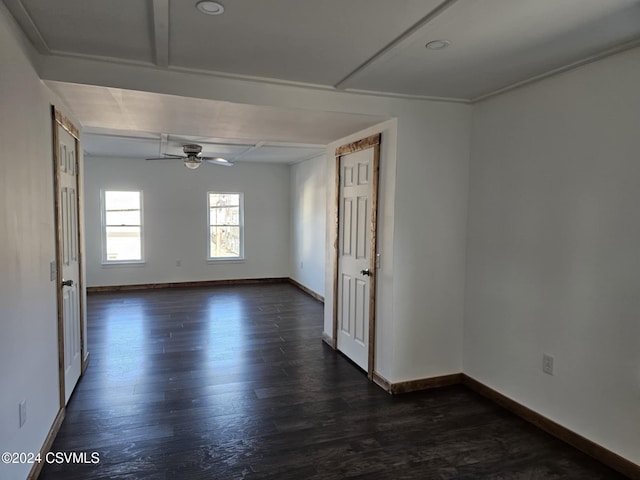 empty room with ceiling fan and dark hardwood / wood-style floors