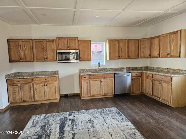 kitchen featuring dark hardwood / wood-style flooring, stainless steel appliances, coffered ceiling, and sink