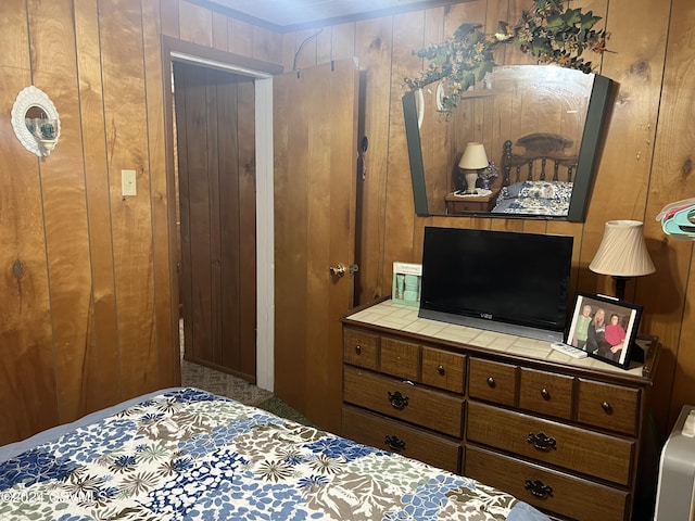 bedroom with wooden walls