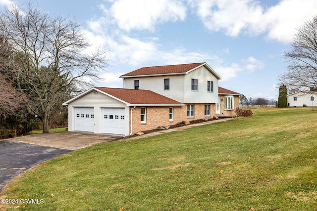 exterior space with a front yard and a garage