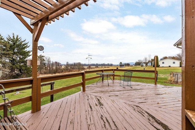 wooden deck featuring a pergola and a yard