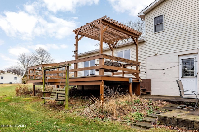 wooden deck with a pergola and a yard