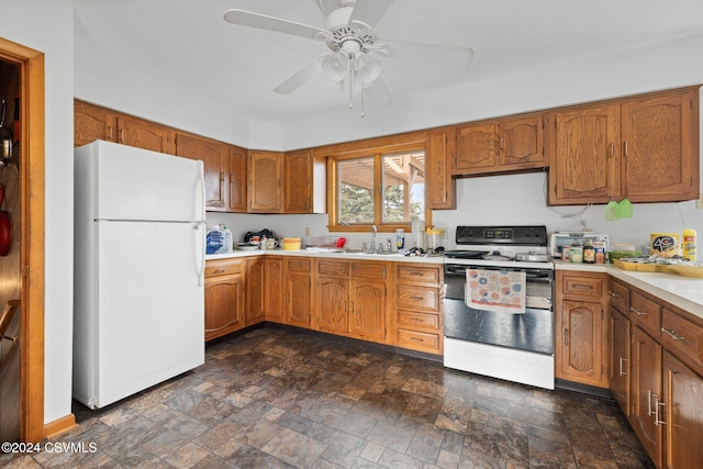 kitchen with ceiling fan, sink, and white appliances