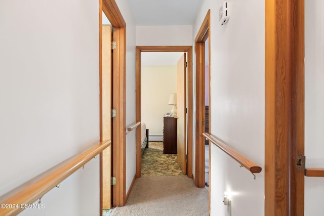 corridor featuring light colored carpet and a baseboard radiator