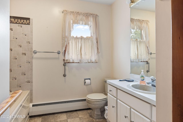 bathroom with vanity, toilet, and baseboard heating