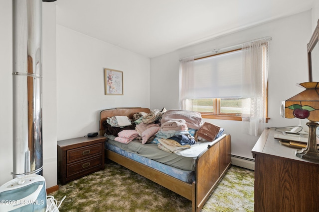 carpeted bedroom featuring a baseboard radiator