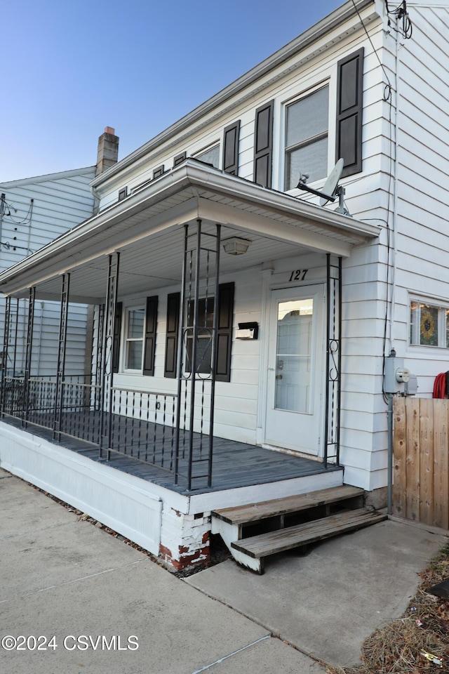 doorway to property with a porch