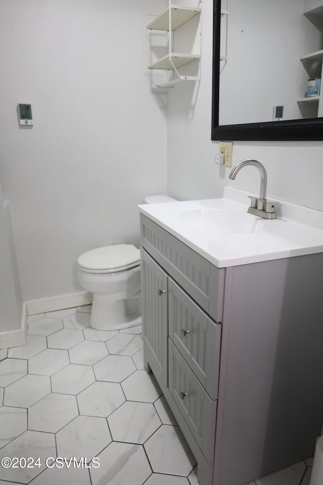 bathroom with vanity and toilet