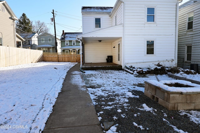 view of snow covered house