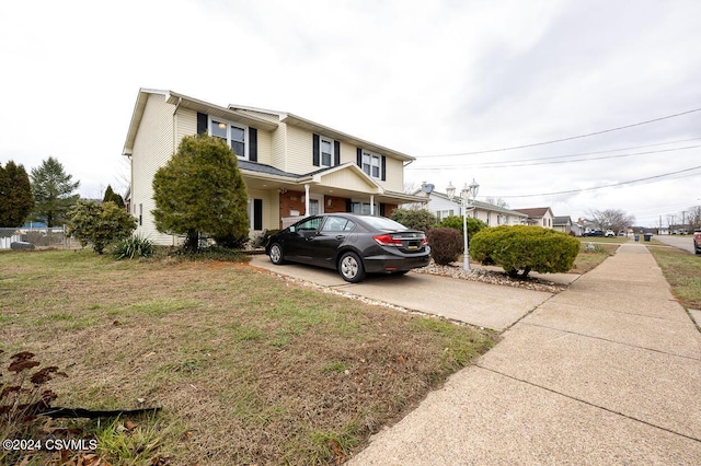 view of front of home with a front lawn