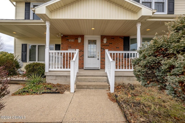 doorway to property with covered porch