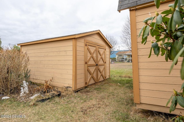 view of outbuilding with a yard