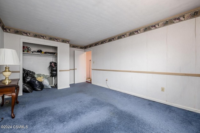 interior space with carpet flooring and a closet