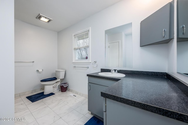 bathroom with vanity and toilet