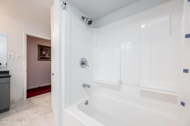 bathroom with vanity and shower / washtub combination