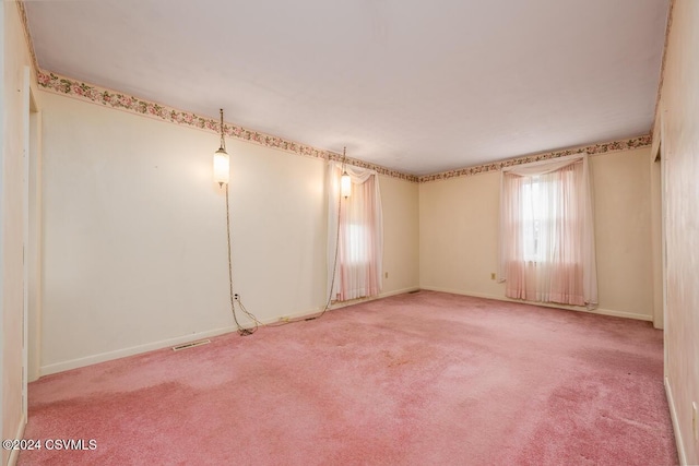 unfurnished room featuring light colored carpet