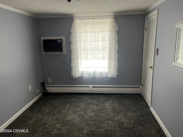 spare room featuring dark colored carpet, ornamental molding, a wall mounted AC, and a baseboard heating unit