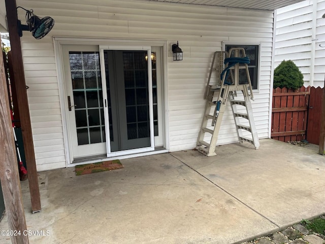 entrance to property featuring a patio area