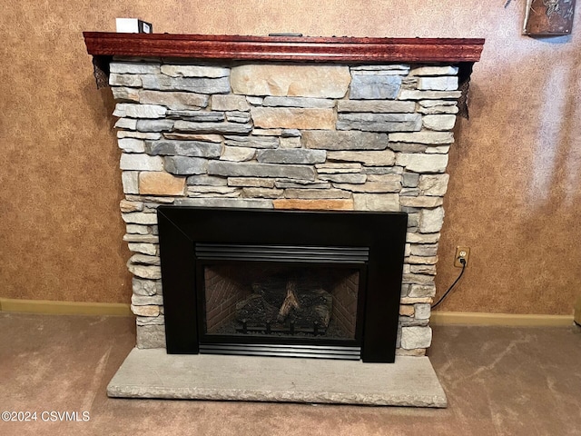 interior details featuring carpet flooring and a fireplace