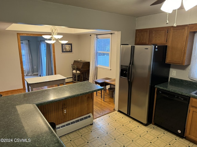 kitchen featuring stainless steel fridge, ceiling fan with notable chandelier, baseboard heating, dishwasher, and hanging light fixtures