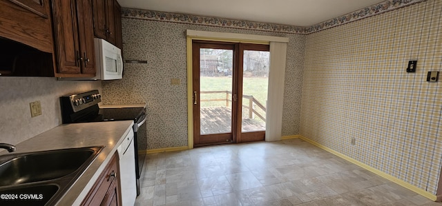 kitchen featuring electric range and sink