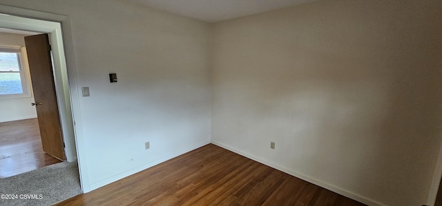 spare room with hardwood / wood-style floors