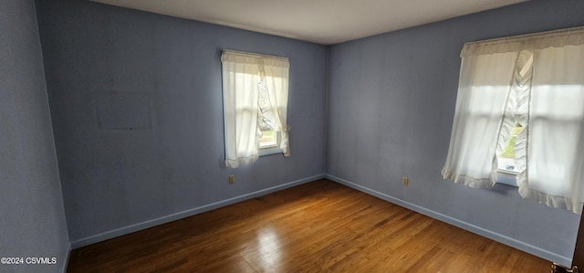 empty room featuring hardwood / wood-style floors