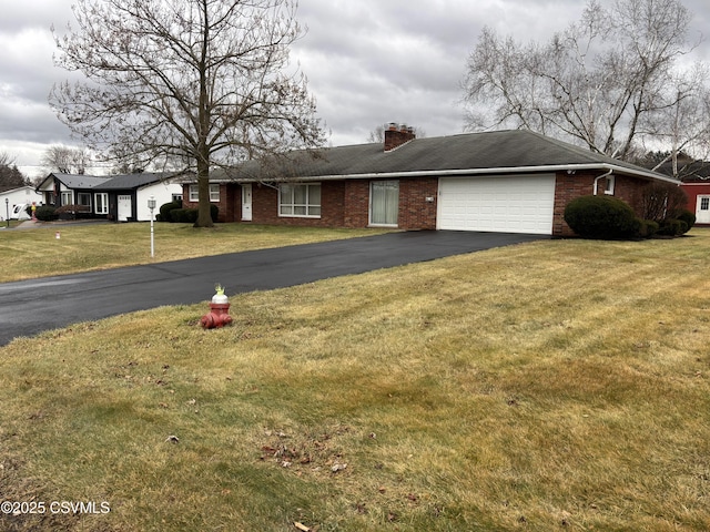 single story home with a front lawn and a garage